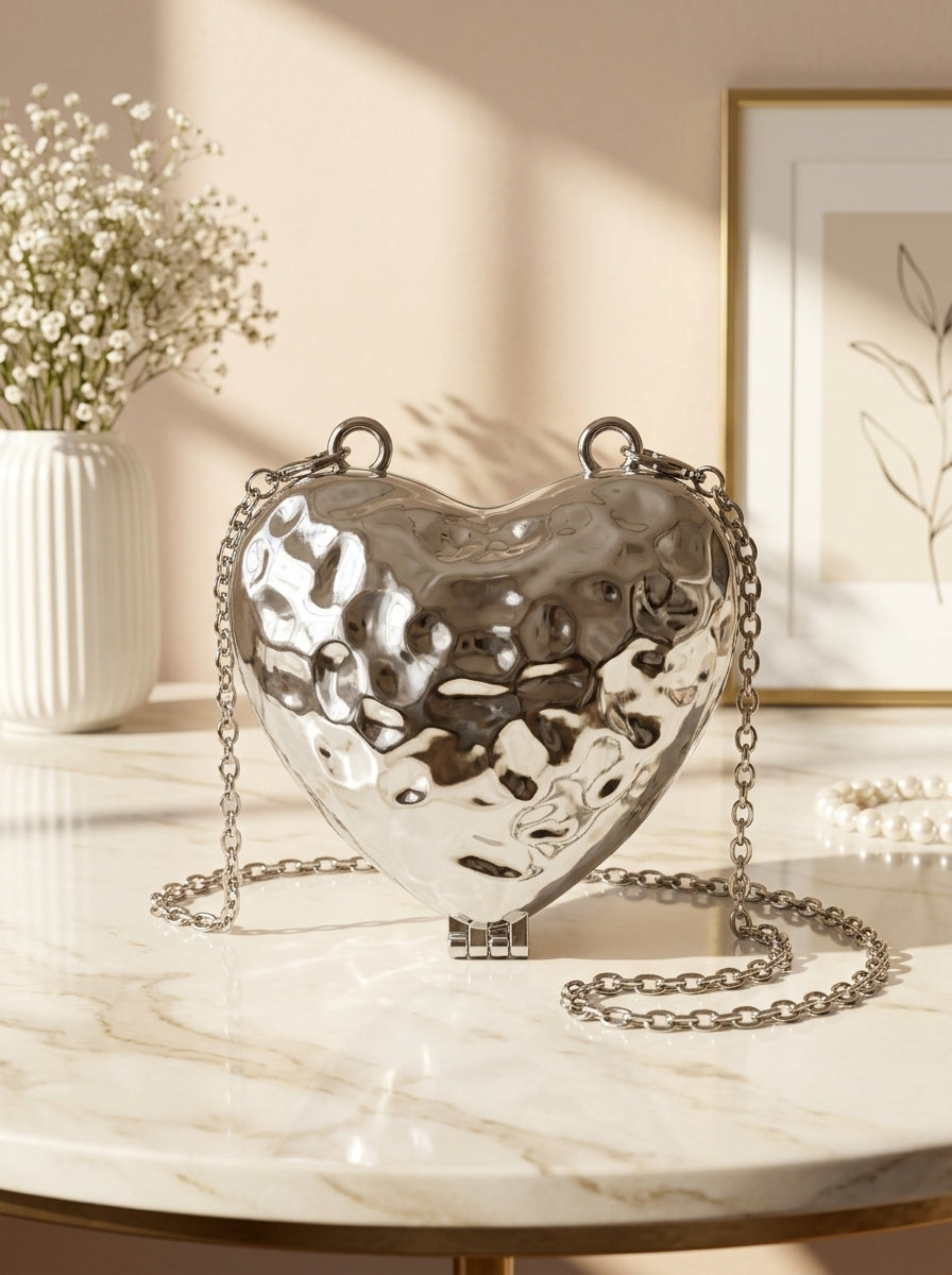 Silver hammered metallic heart evening clutch with chain strap and clasp